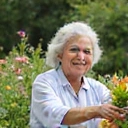 Client photo of a senior woman gardening